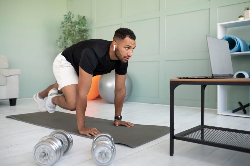 A man doing a 10-minute home workout with mountain climbers on a mat in a living room.