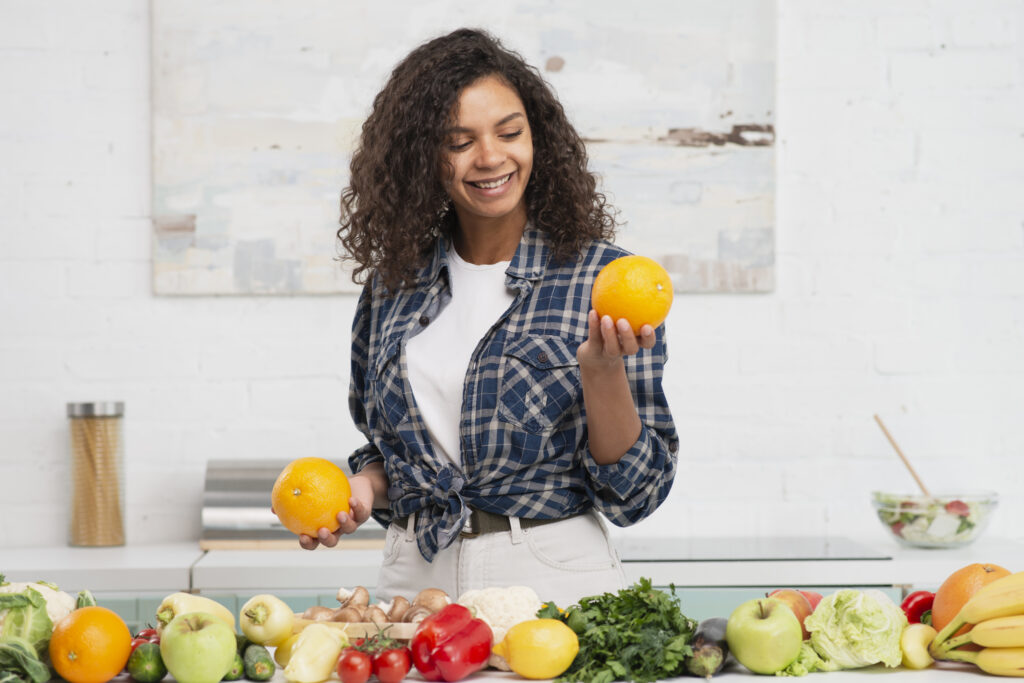 A woman choosing fresh fruits and vegetables as part of a healthy diet plan with foods for ulcer patients