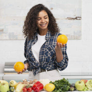 A woman choosing fresh fruits and vegetables as part of a healthy diet plan with foods for ulcer patients