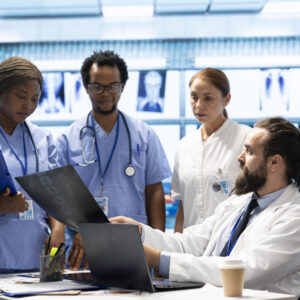 Healthcare professionals discussing patient reports and treatment plans, showcasing real-world opportunities in health careers without a degree
